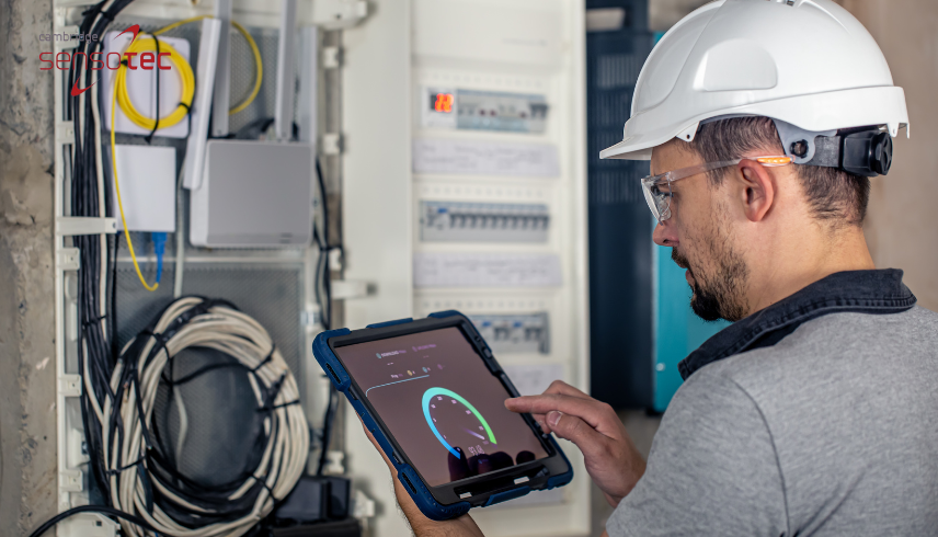 Technician monitoring switchgear performance as part of transition to SF6-free systems.