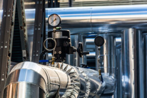 Industrial gas piping and pressure gauges used in high-voltage equipment systems